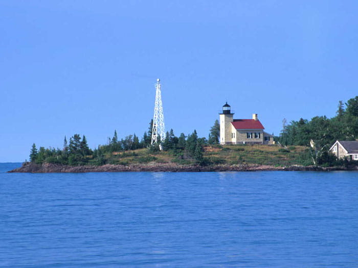 lighthouse with water in front