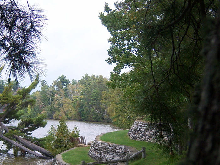 stone terraced wall above lake