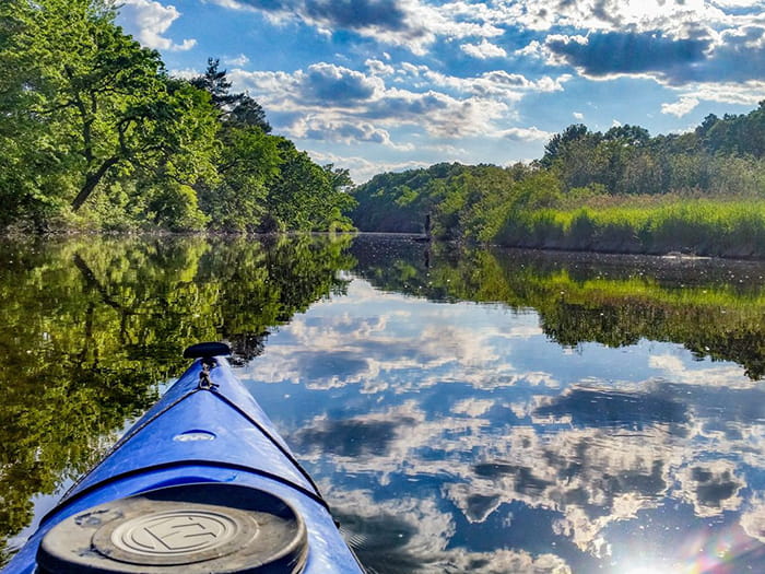 tip of kayak traveling down Huron River