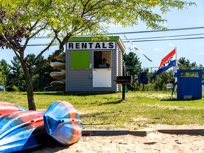 kayaks in front of rental building