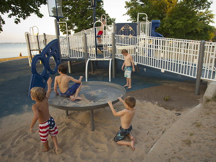kids playing on play equipment