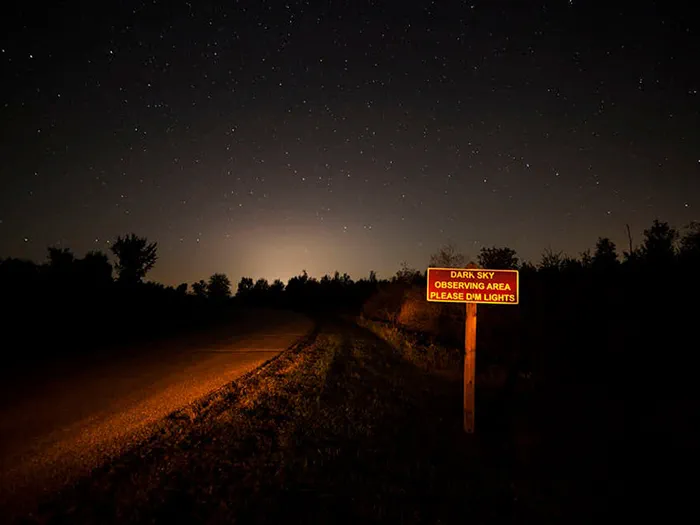 dark sky preserve entrance sign along road