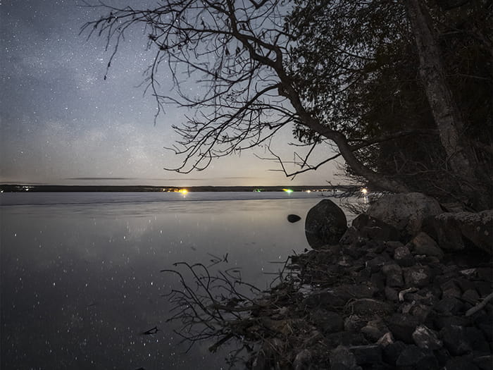 starry sky above lake