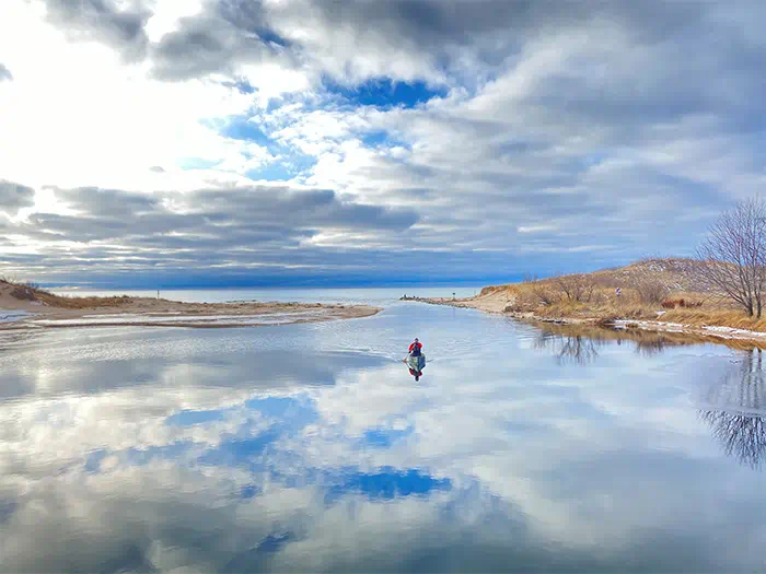 kayaker paddling at mouth of Big Sable River