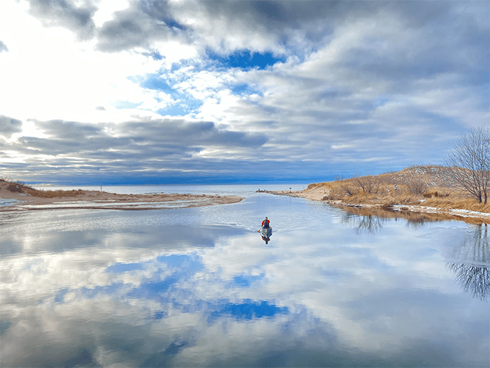 kayaker paddling at mouth of Big Sable River