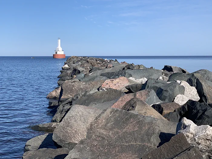 Keweenaw Waterway Lighthouse beyond rocks