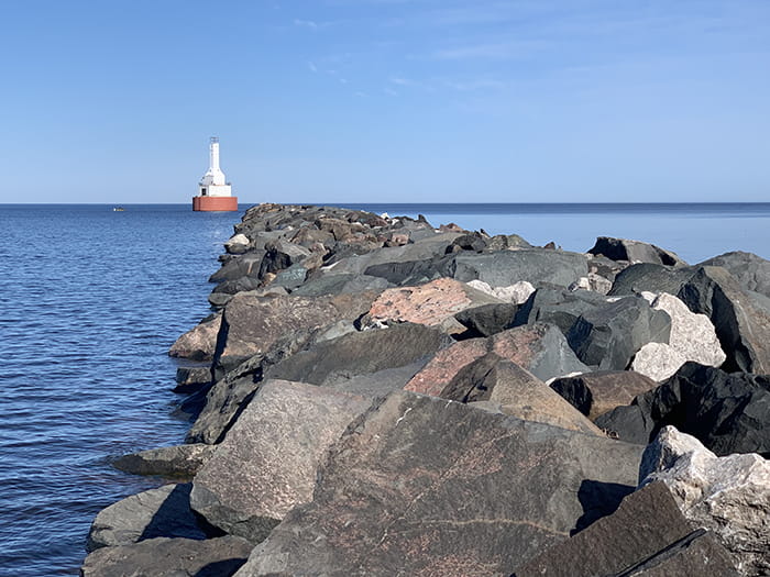 Keweenaw Waterway Lighthouse beyond rocks