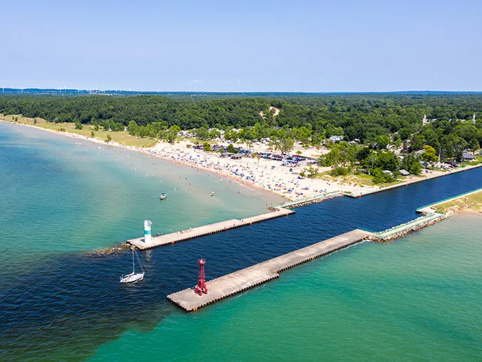motorized boat entering Lake Michigan from channel