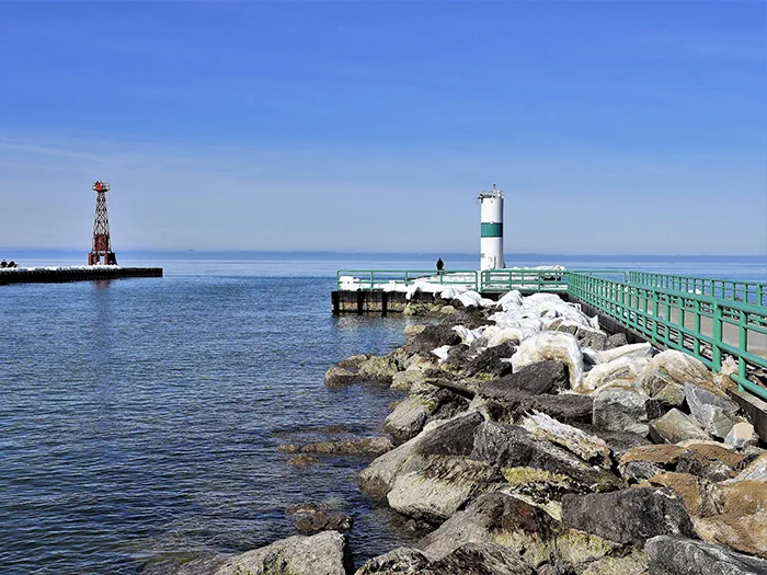 pier with two snow covered rocks by photographer Karen Allmond