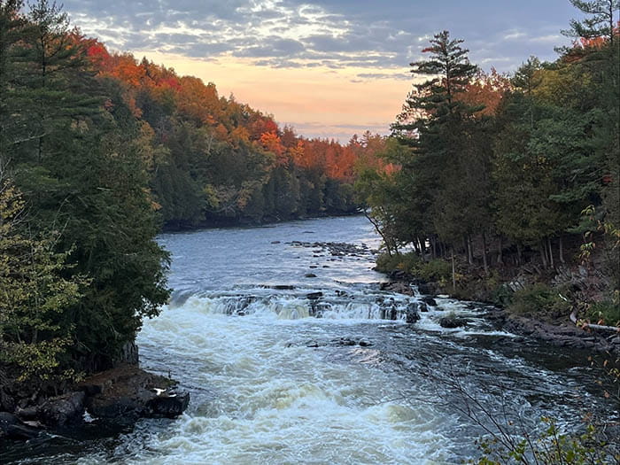 river with trees turning color