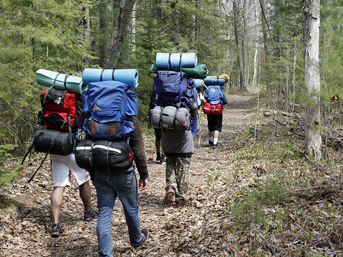 hikers with backpacks on trail
