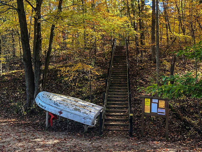 stairs leading to beach with fall foliage photo by Greg Viau