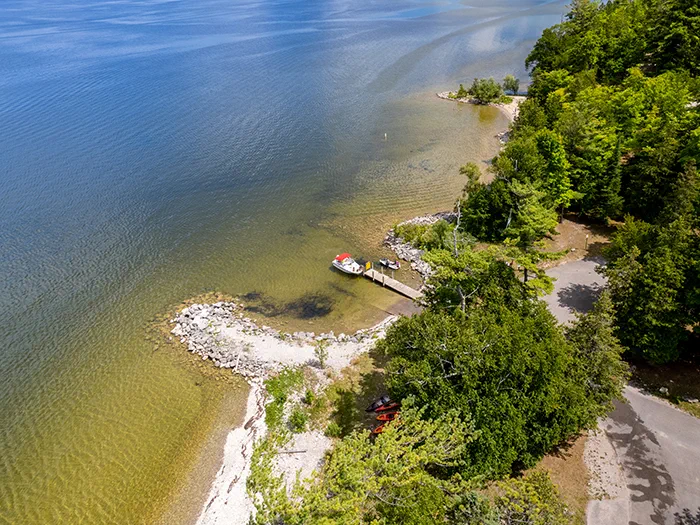 Birds eye view of water parking lot and boat ramp