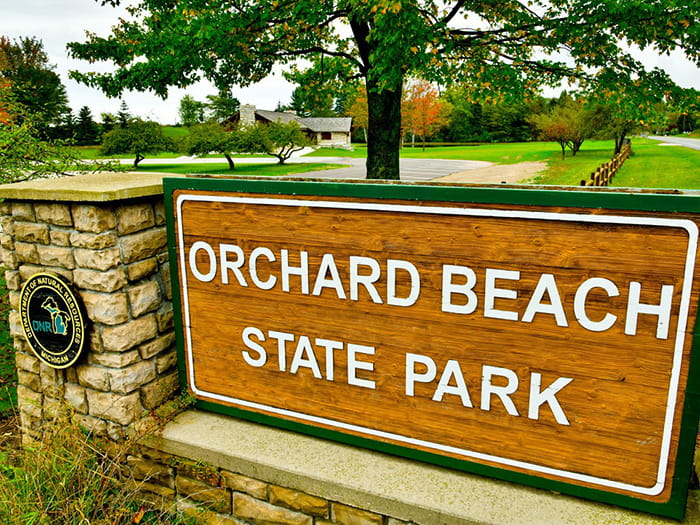 park sign reading Orchard Beach State Park