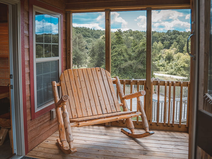 overnight rental with wooden porch and rocker