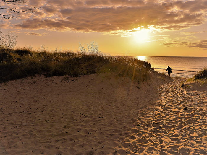 man heading to beach photo by Karen Allmond