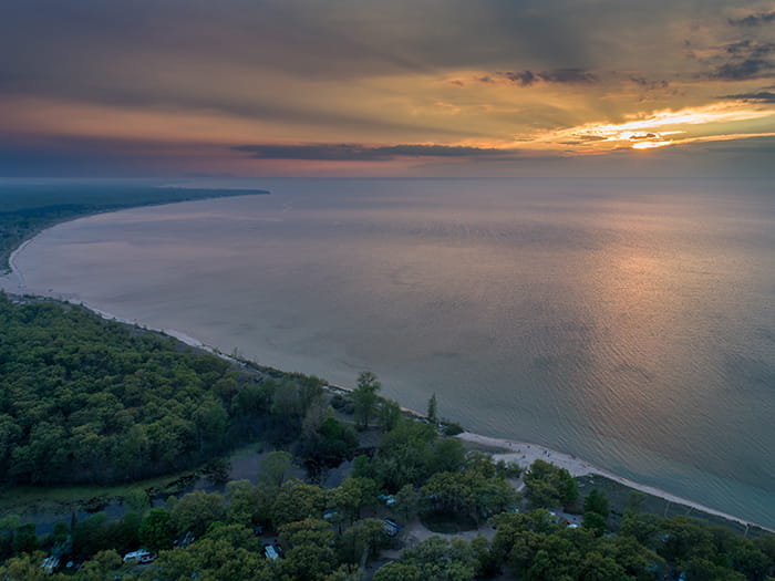 shoreline with sun setting