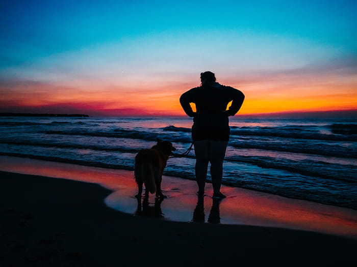 silhouette of woman and dog photo by Samantha Hagemann instagram AdventuresOfAGreatLakesGirl