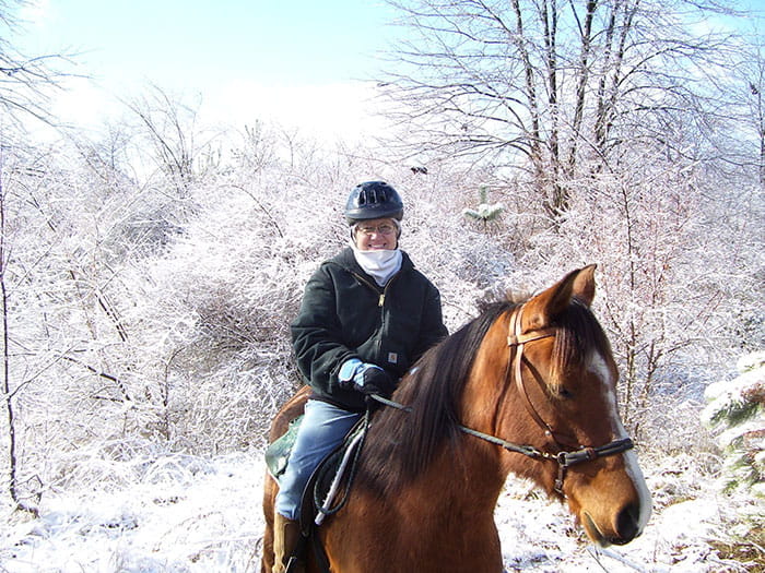 horseback rider on snowy trail