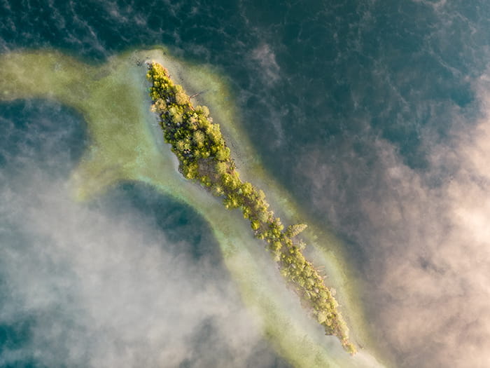 land surrounded by water
