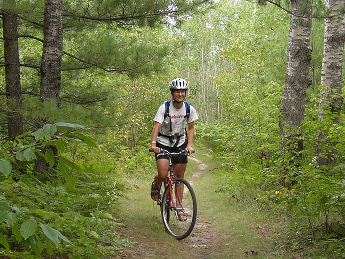 woman mountain biking at Rifle River