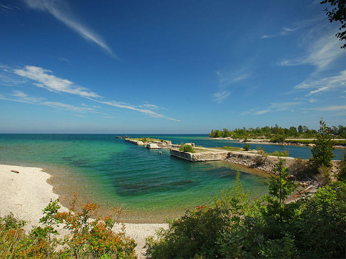 Man-made limestone formations shaped like a dock extending into Lake Huron