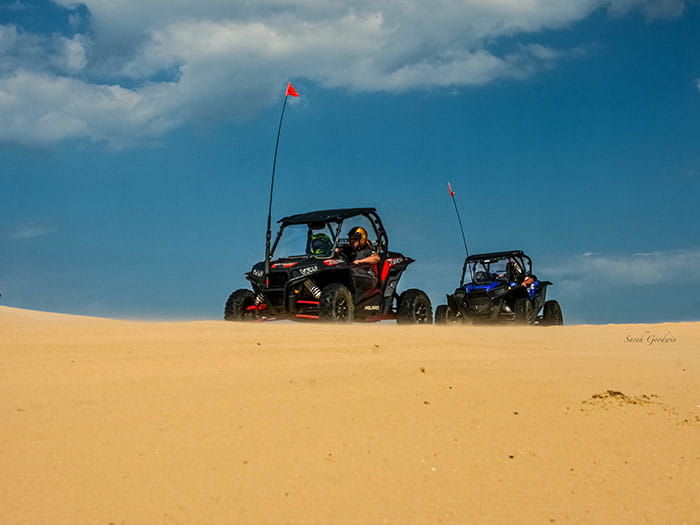 two buggies on top of dune