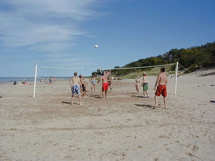 men playing beach volleyball