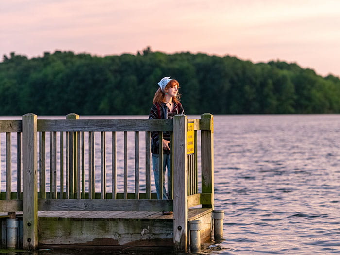 visitor looking out over fishing pier