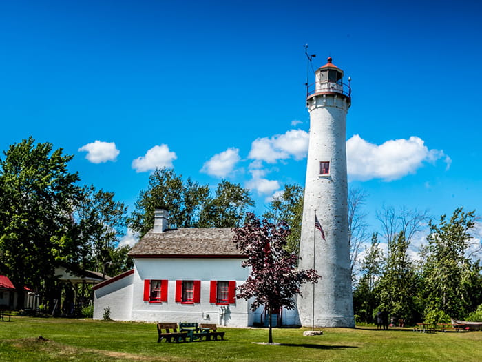 lighthouse under blue sky