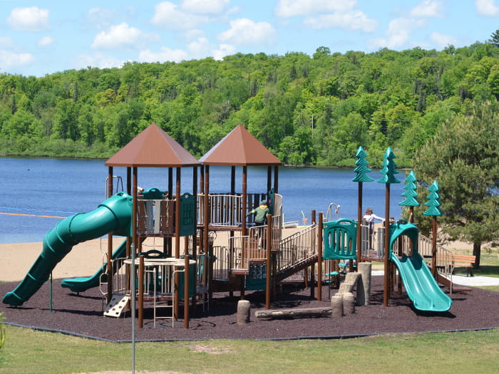 accessible playground with lake in background
