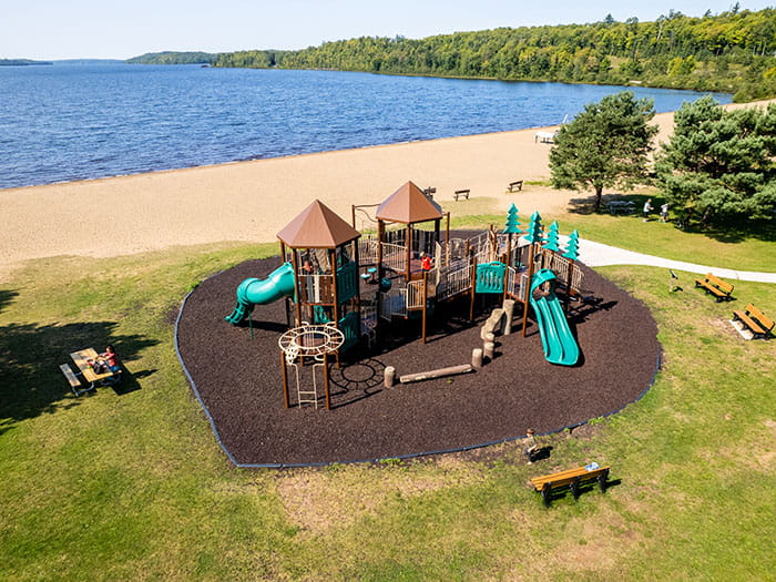 accessible playground with lake in background