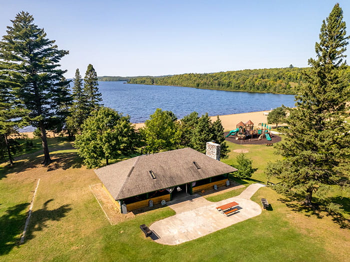 Aerial photograph overlooking Lake Michigamme, building and sandy beach