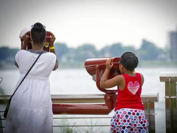 visitors looking at river