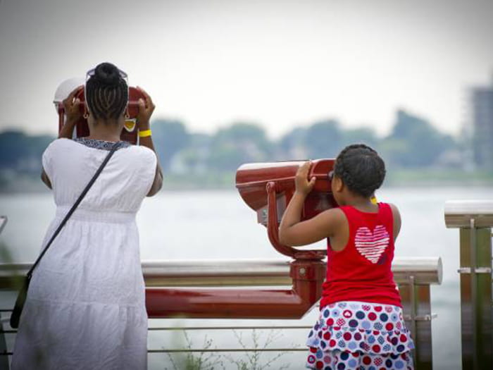 visitors looking at river