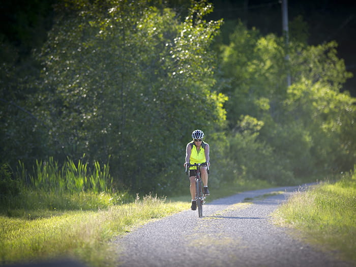 A cyclist on a crushed gravel path