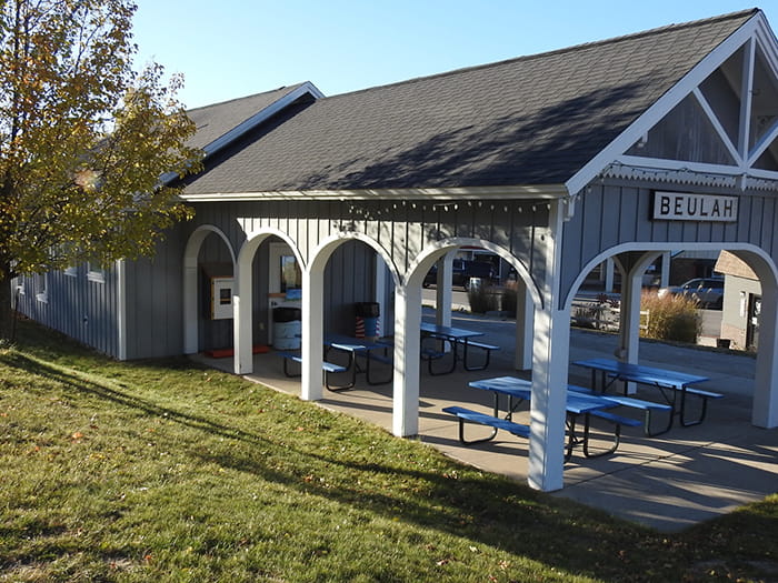 A covered picnic area and trailhead with a sign reading "Beulah"