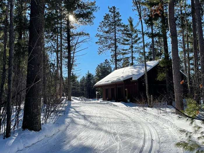 groomed trail with cabin