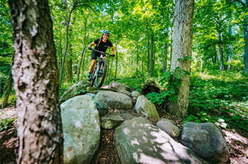 a mountain approaching rock obstacle along trail