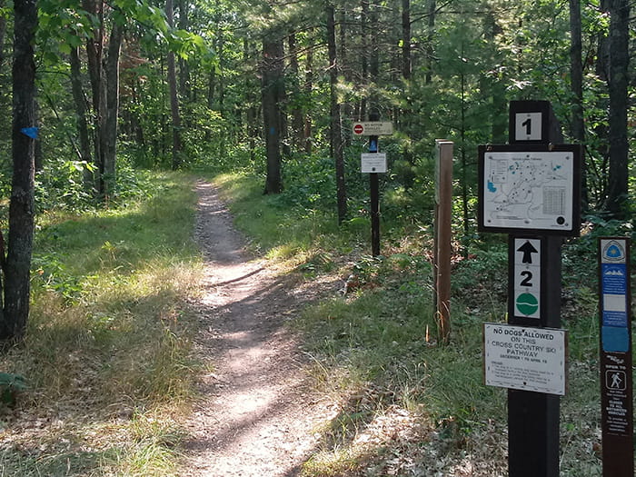 A trail marker on the Muncie Lake Pathway