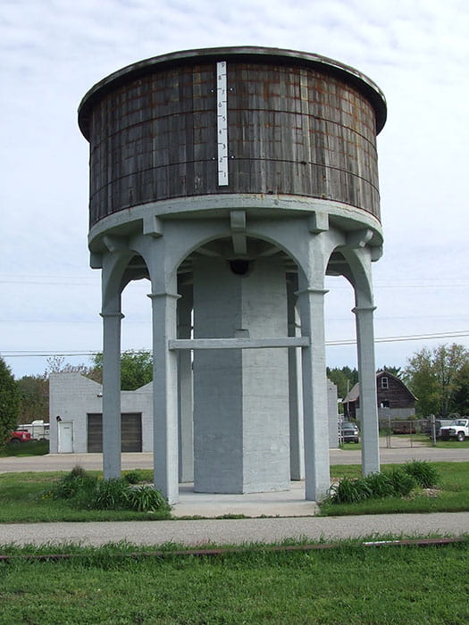 A historic water tower next to a bike trail