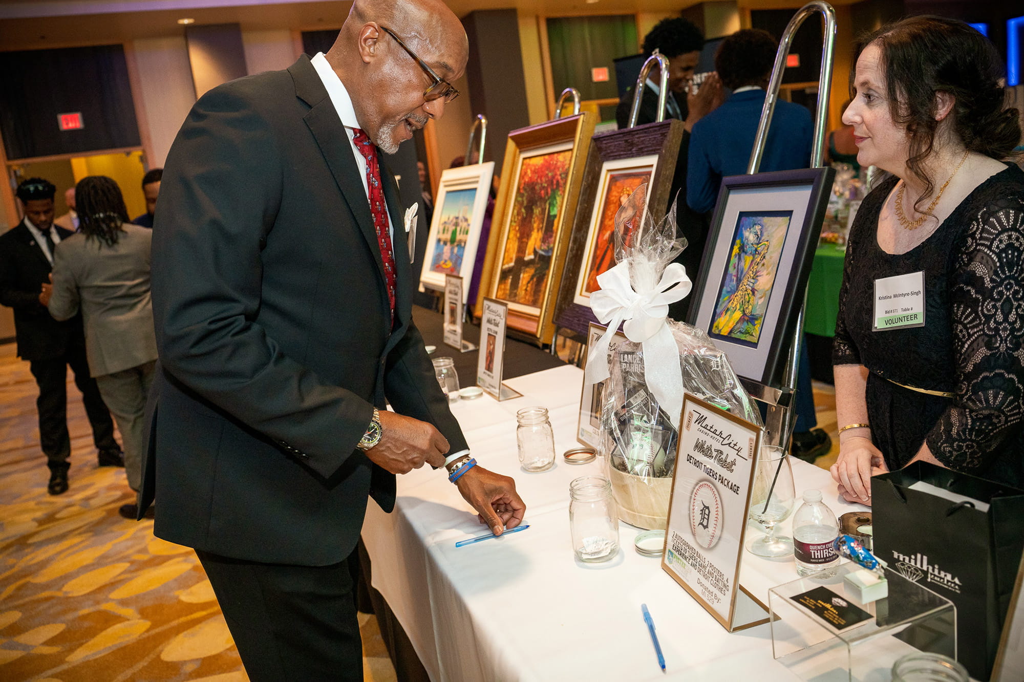 A guest of the Gala makes a bid on a raffle item, raising money for scholarships for college students that have experienced Foster Care