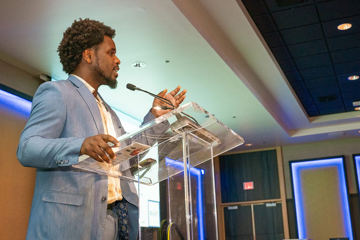 A presenter at the podium, speaking to Gala attendees