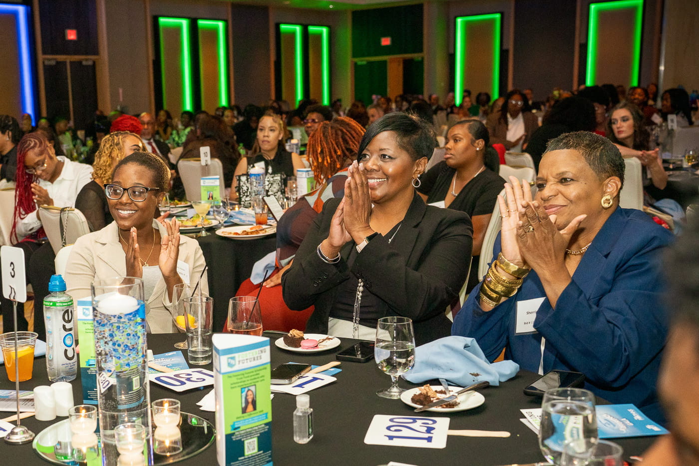 A table full of attendees at the Gala enjoying dinner and listening to the speakers