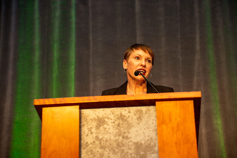Elizabeth Hertel at the podium at the Fostering Futures Scholarship Making a Difference Gala