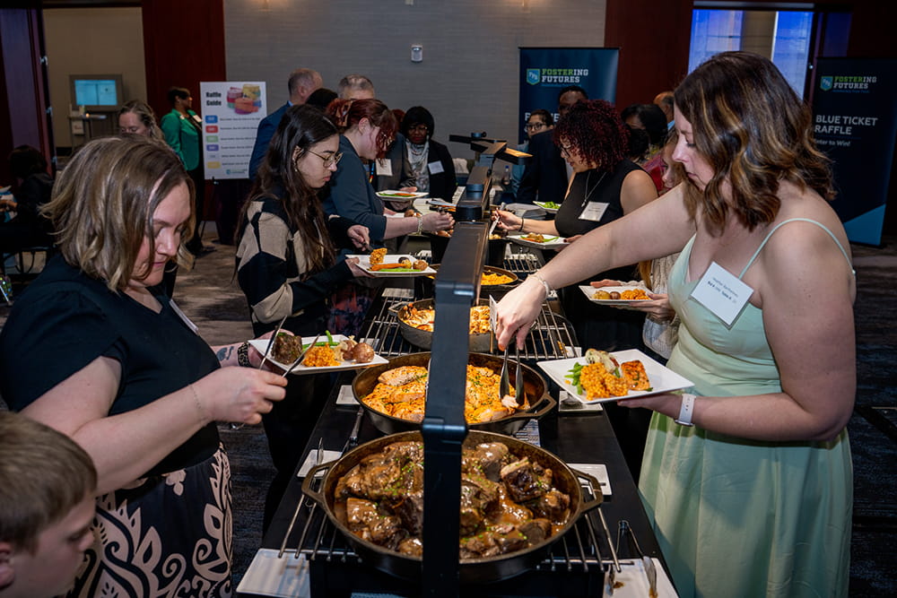 Guests get food at the buffet