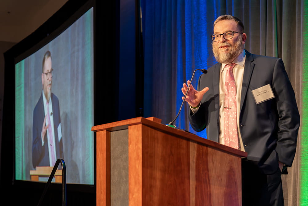 Keynote speaker Michael Fenning of Lansing Community College, speaking on his experience in foster care.