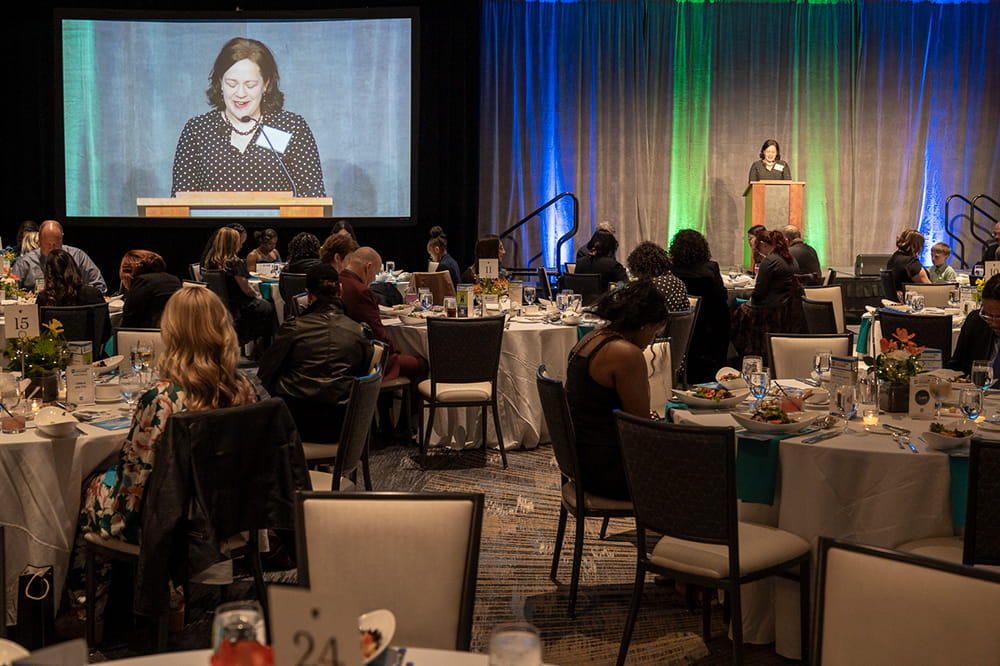 Rev. Dr. Christy Lipscomb gives the opening prayer