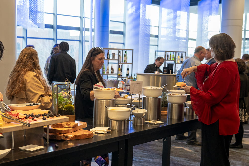 Guests get appetizers during the reception