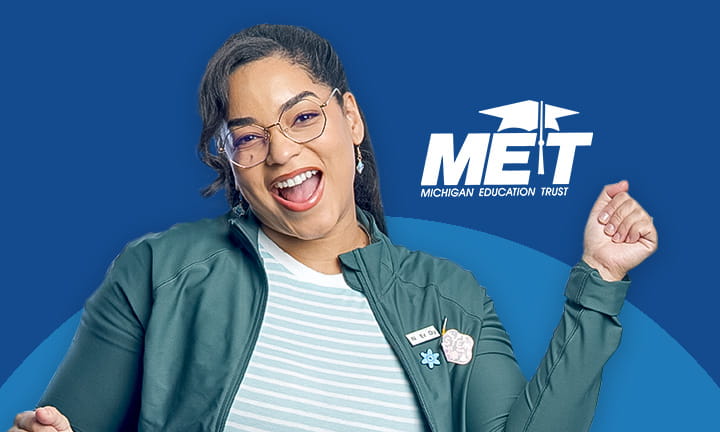 Teacher with happy face and MET logo